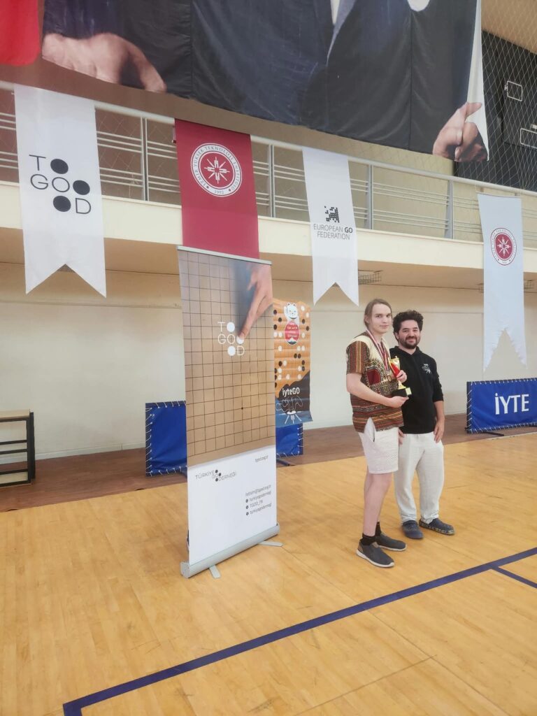 The champion receiving the trophy