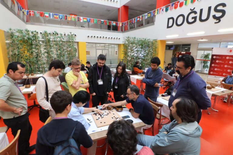 Spectators standing around a game in progress